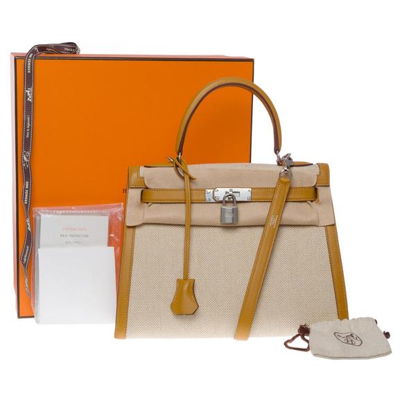 HERMES New Kelly 28 sellier handbag strap in beige canvas and gold leather, SHW - Picture 1 of 12